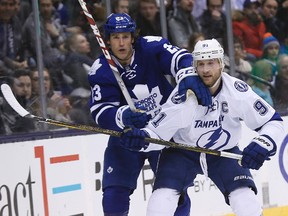 Maple Leafs' Brooks Laich (left) and Tampa Bay Lightning forward Steven Stamkos mix it up during Monday's game at the Air Canada Centre. Laich, acquired from the Capitals on Sunday night, says he aims to help the young Leafs feel comfortable. (USA TODAY SPORTS/PHOTO)