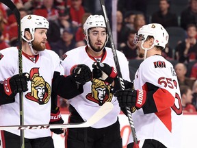 Ottawa Senators center Zack Smith celebrates his first-period goal with centre Mika Zibanejad and defenceman Erik Karlsson against the Calgary Flames at Scotiabank Saddledome in Calgary on Feb. 27, 2016. (Candice Ward/USA TODAY Sports)