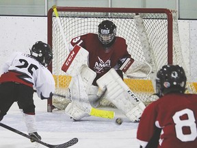 Novice black Hawk Garett Lundgren takes a shot on the Airdrie net during the team’s final game of the season last Sunday at the Vulcan District Arena. Despite outshooting Airdrie 25-22, the novice black squad fell to Airdrie 8-2, eliminating them from the playoff series.