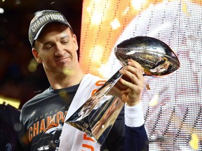 Denver Broncos quarterback Peyton Manning (18) hoists the Vince Lombardi Trophy after defeating the Carolina Panthers in Super Bowl 50 at Levi's Stadium. Mark J. Rebilas-USA TODAY Sports
