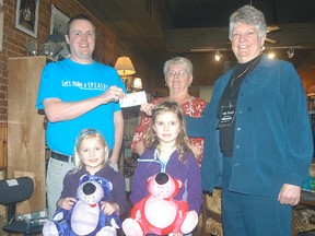 Matt Mikhaila, along with daughters Sydney and Robyn, accept a donation for $500 for the Wallaceburg Splash Pad from Re:Find volunteers Marianne Dykema and Dianne Matak. The splash pad has raised just short of $50,000 of their $200,000 fundraising goal. Re:Find is owned and operated by Wallaceburg Christian School. The James Street store is run by volunteers, with a portion of each month's sales donated to a local charity.