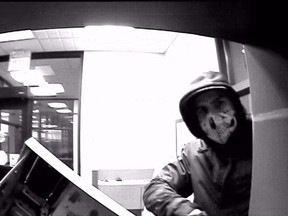 A photo of a suspect taken from surveillance footage who is wanted by RCMP for allegedly stealing a garbage truck and then using the truck to steal an ATM from a Bank of Montreal in Thorsby, Alta. on Monday, Feb. 29, 2016.