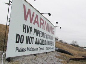 A sign on the Canadian side of the St. Clair River is shown on Tuesday March 1, 2016 in Sarnia, Ont., marking the location of a Plains Midstream Canada pipeline. The company's pipelines under the river that separate Michigan and Ontario has been attracting attention in recent days. (Paul Morden/Sarnia Observer/Postmedia Network)