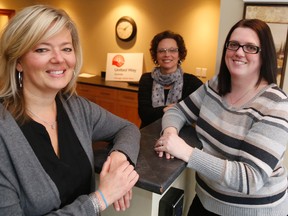 Jason Miller/The Intelligencer
United Way Quinte executive director Judi Gilbert and directors Brandi Hodge (first from left) and Amy Watkins (first right) announced Tuesday the agency will be pumping $1.2 million of funds raised toward a string of initiatives like poverty reduction and child and youth development.