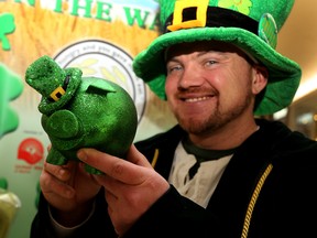 Emily Mountney-Lessard/The Intelligencer
Matthew Bewsky — who dresses up like a leprechaun each year for Gleaners Food Bank Shamrocks on the Wall fundraiser — holds a piggy bank while promoting the annual campaign, on Tuesday.
