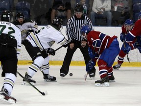 Kingston Voyageurs' Jacob Hanlon faces off against Cobourg Cougars’ Patrick MacDonald during an OJHL game at the Invista Centre in September. The teams open a first-round playoff series Thursday night in Kingston. (Whig-Standard file photo)