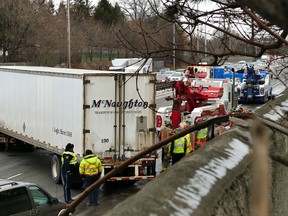 A jack-knifed tractor-trailer is seen in the westbound lanes of the QEW west of Hurontario Tuesday, March 1 after a crash that sent at least one person to hospital. (Pascal Marchand/Special to the Toronto Sun)