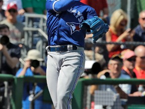 Blue Jays pitcher Marcus Stroman throws to first base after fielding a single against the Phillies in Clearwater, Fla., yesterday. (Canadian Press)