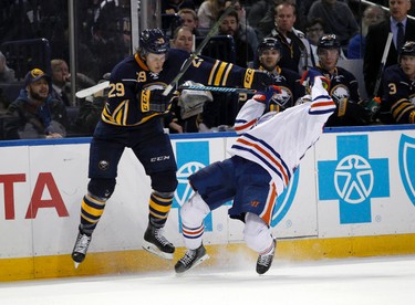 Mar 1, 2016; Buffalo, NY, USA; Buffalo Sabres defenseman Jake McCabe (29) and Edmonton Oilers right wing Nail Yakupov (10) collide during the third period at First Niagara Center. Edmonton beats Buffalo 2 to 1 in overtime. Mandatory Credit: Timothy T. Ludwig-USA TODAY Sports