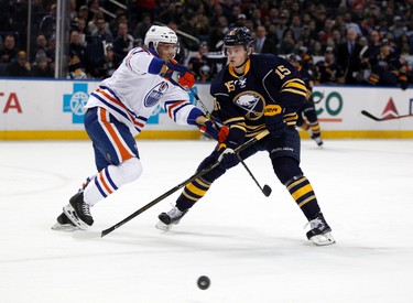 Mar 1, 2016; Buffalo, NY, USA; Edmonton Oilers defenseman Andrej Sekera (2) and Buffalo Sabres center Jack Eichel (15) look for the puck during the second period at First Niagara Center. Mandatory Credit: Timothy T. Ludwig-USA TODAY Sports
