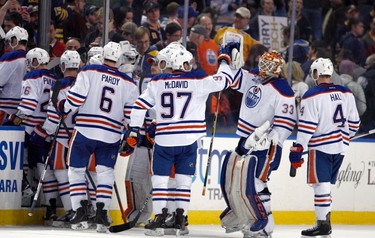 Mar 1, 2016; Buffalo, NY, USA; Edmonton Oilers center Connor McDavid (97) celebrates his overtime goal with Edmonton Oilers goalie Cam Talbot (33) against the Buffalo Sabres at First Niagara Center. Edmonton beats Buffalo 2 to 1 in overtime. Mandatory Credit: Timothy T. Ludwig-USA TODAY Sports