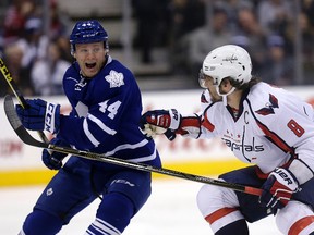 Defenceman Morgan Rielly of the Toronto Maple Leafs and Alexander Ovechkin of the Washington Capitals. (CRAIG ROBERTSON/Toronto Sun)