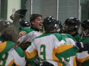 Members of the Lockerby Vikings celebrate after defeating the St. Charles Cardinals to capture the N.O.S.S.A. title in Sudbury, Ont. on Tuesday March 1, 2016. Gino Donato/Sudbury Star/Postmedia Network