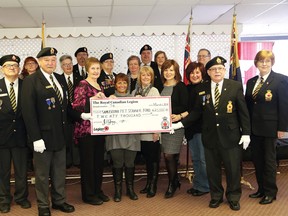 Members of Branch 76 of the Royal Canadian Legion present a $20,000 cheque to representatives of the Sam Bruno P.E.T. Scan Committee at the legion in Sudbury, Ont. on Tuesday March 1, 2016. The donation comes from the legion's 2015 Poppy Campaign. John Lappa/Sudbury Star/Postmedia Network