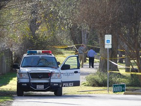 Euless police work the scene after a fatal shooting at J.A. Carr Park, Tuesday, March 1, 2016, in Euless, Texas. A police officer and an armed suspect have been killed in the shootout at the park according to authorities. (Khampha Bouaphanh/Star-Telegram via AP)