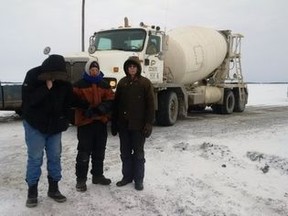 Farmers gathered to protest the latest round of Bipole construction on the weekend, arguing equipment poses the risk of spreading soil contamination. From left to right, Jurgen Kohler, Tim Wiens, and Alvin Wiens were part of the human blockade. (Handout)