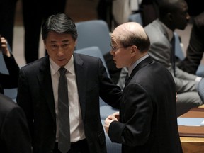 South Korean ambassador Oh Joon (L) speaks with the Chinese ambassador Liu Jieyi before the start of the United Nations Security Council meeting on North Korea at the United Nations Headquarters in New York March 2, 2016. REUTERS/Brendan McDermid