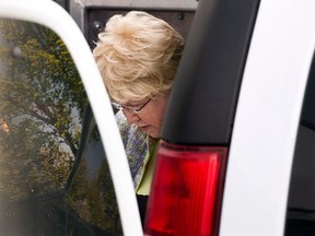 Melissa Ann Shepard arrives at Supreme Court in Sydney, N.S., for her sentencing hearing on Tuesday, June 11, 2013. Two men preyed upon by an elderly woman known as the "Internet Black Widow" say they fear for public safety as a Nova Scotia prison prepares to release her onto the street. THE CANADIAN PRESS/Andrew Vaughan