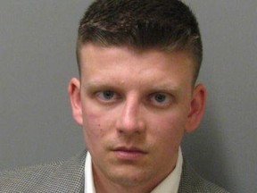 This undated photo provided by the Montgomery County Sheriffï's Office shows Montgomery Police officer Aaron Smith. Smith has been charged with murder in the shooting death of a black man, Greg Gunn, outside a neighbor's home. (Montgomery County Sheriffs Office via AP)
