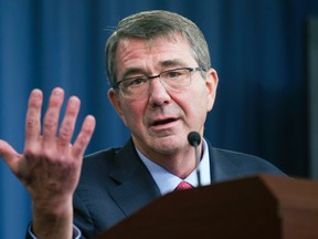 Defense Secretary Ash Carter gestures during a news conference at the Pentagon. (AP Photo/Cliff Owen, File)