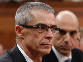 Canadian Security Intelligence Service (CSIS) director Michel Coulombe (L) waits to testify before the Commons public safety and national security committee with Canada's Public Safety Minister Steven Blaney on Parliament Hill in Ottawa October 8, 2014. REUTERS/Chris Wattie