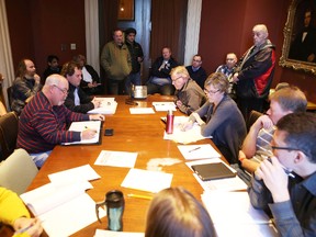 Members of a subcommittee of the Kingston and Loyalist Township Taxi Commission discuss options to regulate Uber in the city at a meeting on Wednesday. (Elliot Ferguson/The Whig-Standard)