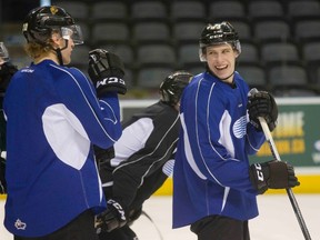 Mitch Marner laughs with Christian Dvorak during London Knights team practice in London on Wednesday. (DEREK RUTTAN, The London Free Press)