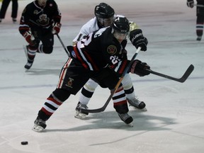 Sarnia Legionnaires forward Alec Dekoning fends off Eric Kirby of the LaSalle Vipers during Game 1 of the teams' Greater Ontario Junior Hockey League Western Conference quarter-final series at the Vollmer Recreation Complex on Wednesday, March 2, 2016 in LaSalle, Ont. (Terry Bridge/Sarnia Observer/Postmedia Network)