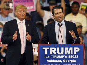 Republican U.S. presidential candidate Donald Trump gives a thumbs up as his son Donald Trump, Jr. speaks at a campaign rally at Valdosta State University in Valdosta, Georgia February 29, 2016. REUTERS/ Philip Sears