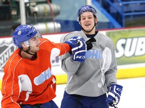 Sudbury Wolves Nicholas Romero, left, and Mikkel Aagaard horse around at practice earlier this season. The Wolves will have to find ways to stay positive, Jeff Giffen writes, with the OHL playoffs out of reach. John Lappa/Sudbury Star