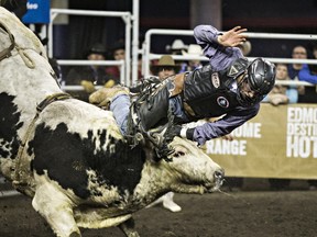 Jared Parsonage takes part in the bull riding event during the 42nd Canadian Finals Rodeo at Rexall Place in Edmonton, Alta., on Saturday, Nov. 14, 2015. File Photo