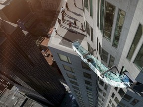 An artist rendering of the "Skyslide" attraction, an outdoor glass slide positioned close to 1,000 feet above downtown Los Angeles, California, is shown in this image released by OUE Skyspace on March 2, 2016. REUTERS/OUE Skyspace/Handout via Reuters