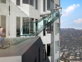 An artist rendering of the "Skyslide" attraction, an outdoor glass slide positioned close to 1,000 feet above downtown Los Angeles, California, is shown in this image released by OUE Skyspace on March 2, 2016. REUTERS/OUE Skyspace/Handout via Reuters
