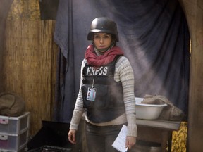 In this image released by Paramount Pictures, Tina Fey portrays Kim Baker in a scene from "Whiskey Tango Foxtrot." (Frank Masi/Paramount Pictures and Broadway Video/Little Stranger Productions)