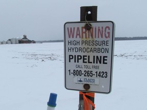 A sign marks a Plains Midstream pipeline on Petrolia Line, just west of Kimball Road, in St. Clair Township on Thursday March 3, 2016 near Sarnia, Ont.. The National Energy Board issued a safety order this week against a pipeline Plains Midstream operates between Sarnia and Windsor.  (Paul Morden/Sarnia Observer/Postmedia Network)