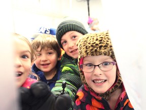 The Grade 1/2 class from Seaforth Public School donated 30 cans of food to the Seaforth and District Food Bank last Monday. They were shown inside the freezer of the charity organization.(Shaun Gregory/Huron Expositor)