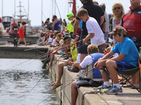 The annual kids’ fishing derby held for the past 16 years at the Portsmouth Olympic Harbour may have to be cancelled this year if the local fish and game club that runs it can’t find someone else to take over. (Whig-Standard file photo)