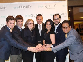 The Minto Group celebrates after receiving the award for Ontario Green Builder of the Year. From left to right: Carl Pawlowski, Wells Baker, Alison Minato, John Meinen (President OHBA), Roya Khaleeli, Kyle Rainbow, and Dominic Damar.