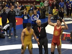 Ben Zahra, right, of Regiopolis-Notre Dame celebrates after defeating Jake Michaelis of Milton in the 77-kilogram final at the Ontario high school wrestling championships in Windsor on Wednesday. (Supplied photo)