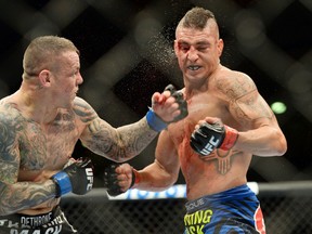 Diego Sanchez (right) takes a left hook from Ross Pearson during their lightweight bout during UFC Fight Night 42 at Tingley Coliseum in Albuquerque, N.M., on June 7, 2014. (Joe Camporeale/USA TODAY Sports)