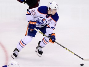 Edmonton Oilers center Ryan Nugent-Hopkins carries the puck in the in a recent game against the Colorado Avalanche at the Pepsi Center. (Ron Chenoy-USA TODAY Sports)