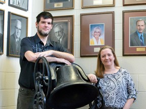 Scott Maclean and Jo-Anne Bishop, co-chairs of the Lorne Avenue End of an Era Bash, proudly display the bell from the original Lorne Avenue school, which opened in 1875 as a two-room schoolhouse. The pair will host a farewell party to the east London school on June 11 to celebrate its impact on the community before it closes later this year. (CRAIG GLOVER, The London Free Press)