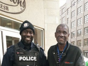 Toronto Police Const. Ed Parks poses with Cleo after he helped him with a meal at Tim Hortons. (Twitter)