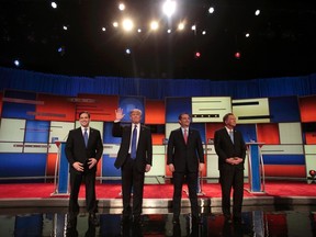 Republican U.S. presidential candidates, from left to right, Marco Rubio, Donald Trump, Ted Cruz and John Kasich pose together at the start of the U.S. Republican presidential candidates debate in Detroit, Michigan, March 3, 2016. (REUTERS/Rebecca Cook)