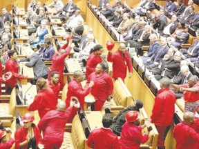 Members of the opposition Economic Freedom Fighters party walk out of parliament as South Africa?s President Jacob Zuma delivers his State of the Nation address in February.  (Schalk van Zuydam/Reuters)