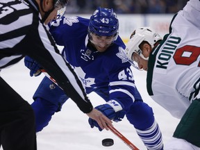 Maple Leafs’ Nazem Kadri and Minnesota Wild’s Mikko Koivu face off during Thursday night's game at the Air Canada Centre. (JACK BOLAND/TORONTO SUN)