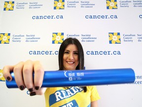 Cancer survivor and Community Champion Dana Crispo gets set to pass the baton in support of the 2016 Relay For Life during the Relay Rally at the Royal Canadian Legion Branch 76 in Sudbury, Ont. on Thursday, March 3, 2016. Gino Donato/Sudbury Star/Postmedia Network