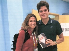 St. Thomas native and sports Dr. Leslie (Goossens) Bottrell meets tennis superstar Milos Raonic at the China Tennis Open, where she was attending players. She gave Raonic a copy of brother J.D. Goossens' book.