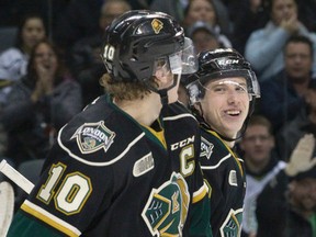 London Knights forward Mitch Marner, right, laughs after a between-the-legs drop pass led to a goal by teammate Christian Dvorak, left, during their OHL hockey game against the Erie Otters at Budweiser Gardens in London, Ont. on Thursday March 3, 2016. Craig Glover/The London Free Press/Postmedia Network