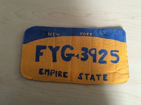 The Erie County Sheriff's Office posted this photo on its Facebook page, with a photo of a replica license plate painted on cardboard. A woman was arrested and charged. (Facebook/Erie County Sheriff's Office)